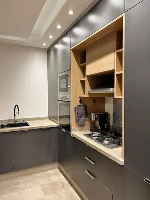 a kitchen with a sink and a stove in it at Bohemian Chic Duplex Marrakech in Marrakech