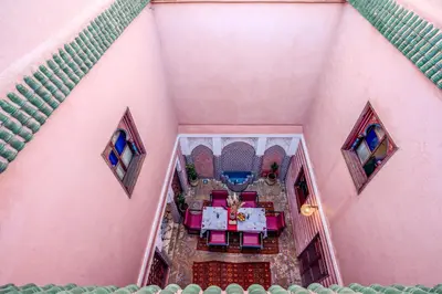 an overhead view of a table and chairs on a house at Riad Le Graff Pink in Marrakech