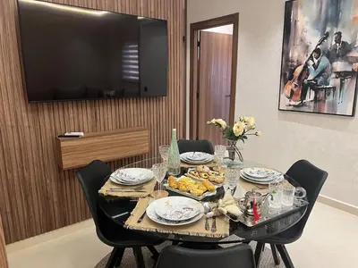a dining room table with a plate of food on it at Design Calme Luxe Fibre Ultra-Rapide 2CH in Marrakech