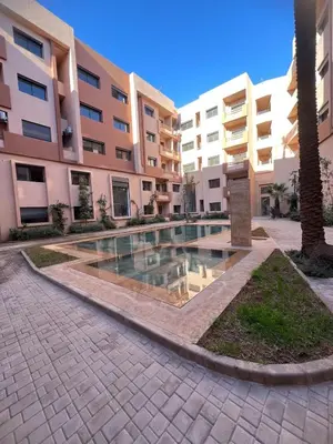 a swimming pool in the middle of a building at Cozy Apartment With Pool 5 min from Guéliz in Marrakech
