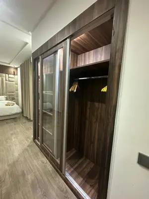 a room with a sliding glass door with a bed at Duplex spacieux avec jaccuzi in Marrakech