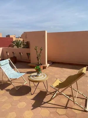 two chairs and a table on a patio at Gueliz ultra central & Cosy in Marrakech