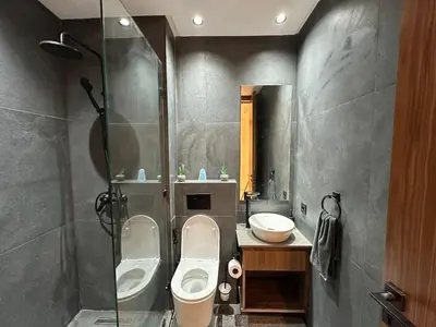a bathroom with a toilet and a sink at NEW LUXURY APARTMENT - ViCTOR HUGO MARRAKECH in Marrakech
