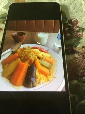 a plate of food with vegetables on a table at Riad shamekh in Marrakech