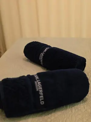 two black socks sitting on top of a bed at Appartement Cosy et Moderne Accès 4 piscines in Marrakech