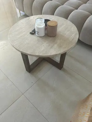 a coffee table in front of a couch at Apartment proche gueliz in Marrakech