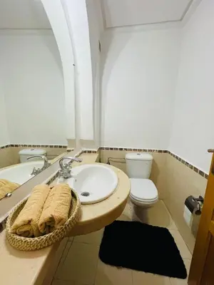 a bathroom with a sink and a toilet at chic nest heart of gueliz With pool in Marrakech