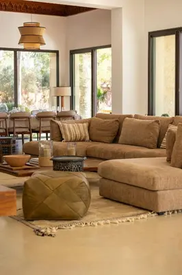 a living room with a couch and a table at Villa Yliane in Marrakech