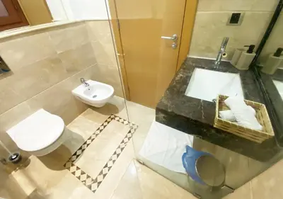 a bathroom with a toilet and a sink at Luxueuse Appart Vizir 106 in Marrakech