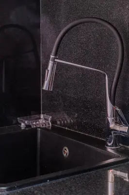 a bathroom sink with a chrome faucet at Luxury 2BR with Pool & Garden View Balcony in Marrakech