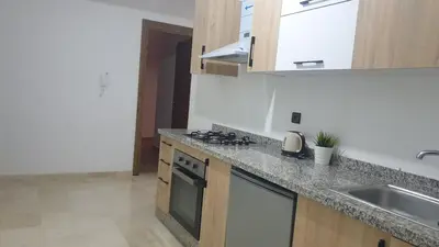 a kitchen with a sink and a stove top oven at apartment 12 Marrakech centr gueliz in Marrakech