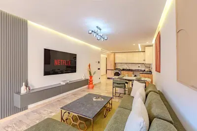 a living room with a couch and a table at Large elegant 2BR Apt in Gueliz in Marrakech