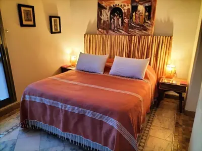 a bedroom with a large bed with two pillows at Marrakech Palmeraie 2 appartement 3 ch 7 pers résidence avec piscine in Marrakech