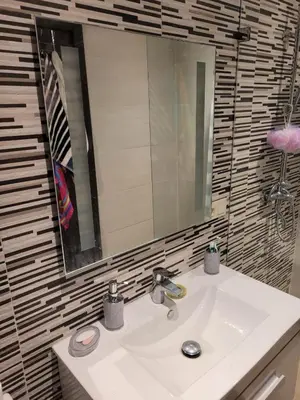 a bathroom with a sink and a mirror at Bel appartement au cœur de Marrakech in Marrakech