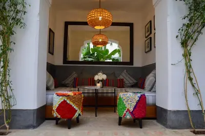 a living room with two chairs and a table at mon riad in Marrakech