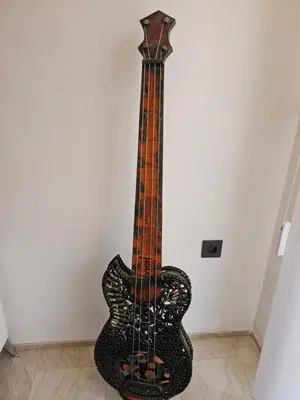 a guitar is leaning against a wall at Apparemment haut de gamme à l'hivernage in Marrakech
