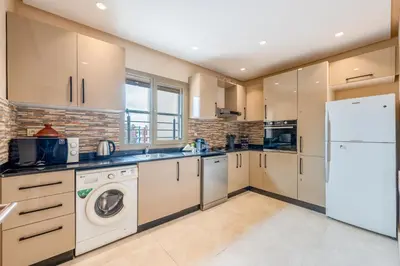 a kitchen with a washer and dryer at Apartment center marrakech - Gueliz in Marrakech