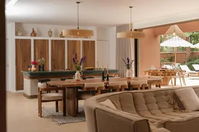 a living room with a couch and a table at Villa Ty Habibi - Super 5 Bedroom with Private Heated Pool by the Golf Amelkis in Marrakech