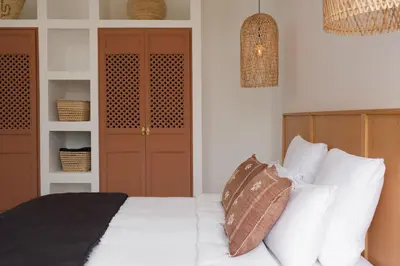 a bedroom with a white bed with white pillows at Villa Ty Habibi - Super 5 Bedroom with Private Heated Pool by the Golf Amelkis in Marrakech