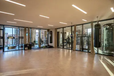 an empty room with glass doors and a gym at Radisson Blu Marrakech, Carré Eden in Marrakech