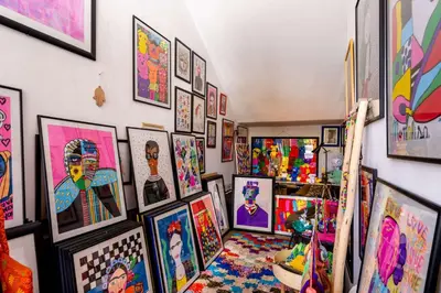 a room filled with lots of art on a wall at Radisson Blu Marrakech, Carré Eden in Marrakech