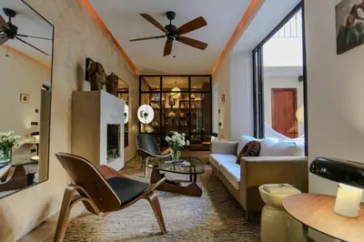 a living room with a couch and a ceiling fan at Riad KO Nova in Marrakech