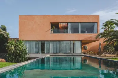 a house with a swimming pool in front of it at Modern Moroccan Villa in Marrakech