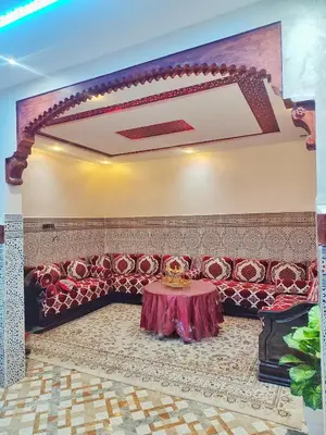 a room with a table in the middle of it at Relaxing Family Home outside Marrakech in Marrakech