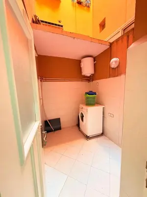 a small bathroom with a toilet in a room at Appartement Tachfine lumineux FAMILY in Marrakech