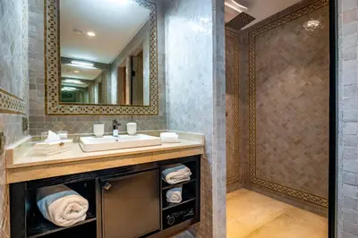 a bathroom with a sink and a mirror at Riad N5 in Marrakech