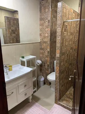 a bathroom with a sink and a toilet and a shower at Superb Location in Marrakech in Marrakech