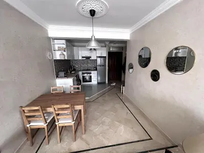 a kitchen and dining room with a table and chairs at Superb Location in Marrakech in Marrakech