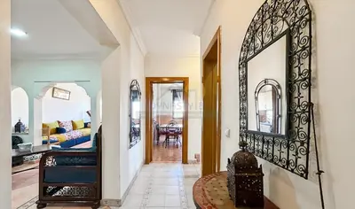 a hallway of a home with a large mirror at Appartement charmant à Guéliz in Marrakech