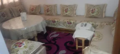 a room with a table and a table and chairs at المغرب in Marrakech