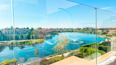 a view of a river from a window at Appartement PRESTIGIA MARRAKECH VILLAGE in Marrakech