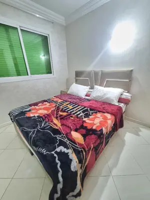 a bedroom with a bed with a colorful blanket on it at Relaxing Stay Close to Everyting in Marrakech
