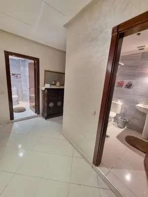 a room with a bathroom with a sink and a mirror at Relaxing Stay Close to Everyting in Marrakech