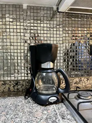 a coffee maker sitting on a counter in a kitchen at appartement guliz in Marrakech