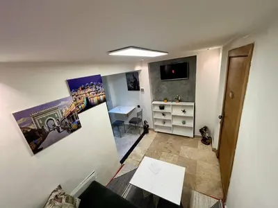 a room with a desk and a table in a room at appartement guliz in Marrakech