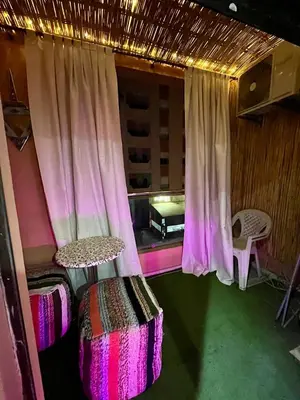 a room with a tent with a bed and a window at appartement guliz in Marrakech