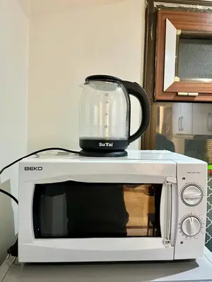 a food processor sitting on top of a microwave at appartement guliz in Marrakech