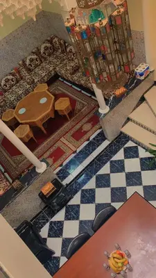 an overhead view of a living room with a table and a floor at Raid Mariama in Marrakech