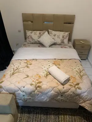 a bed with a blanket and a pillow on it at Raid Mariama in Marrakech