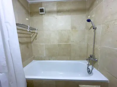 a shower with a white bath tub in a bathroom at Majorelle Apartment 1- Bedroom 1-Terrace Centre in Marrakech