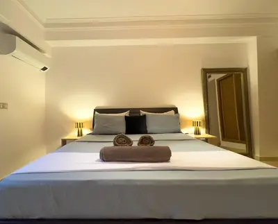 a bedroom with a large bed with two towels on it at Majorelle Apartment 1- Bedroom 1-Terrace Centre in Marrakech