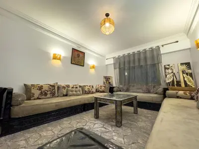 a living room with a couch and a table at Majorelle Apartment 1- Bedroom 1-Terrace Centre in Marrakech