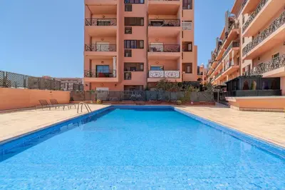 a swimming pool in front of a building at Majorelle Apartment 1- Bedroom 1-Terrace Centre in Marrakech