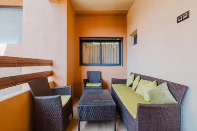 a living room with a couch and two chairs at 1BR Appart 2 min de M Avenue , Pool , Balcony & Parking & 24h j7 security in Marrakech