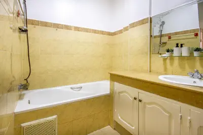 a bathroom with a bath tub and a sink at La Menara - 2 Chambres - Centre - Wifi in Marrakech