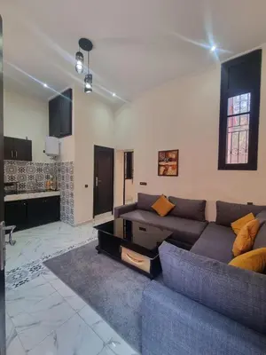 a living room with a couch and a table at Guéliz Spirit in Marrakech